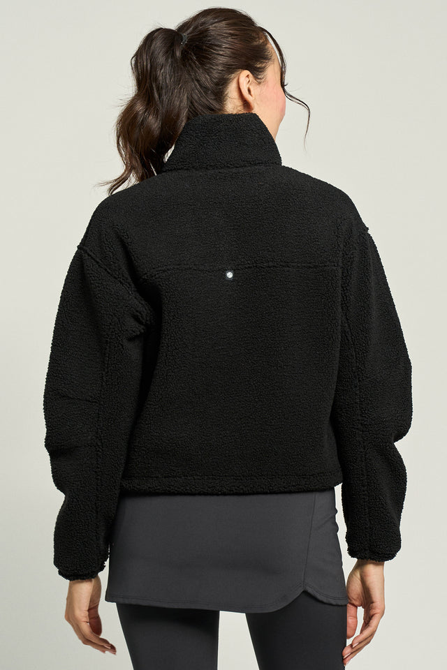 lija-sherpa-jacket-black-tennis-back-jpg